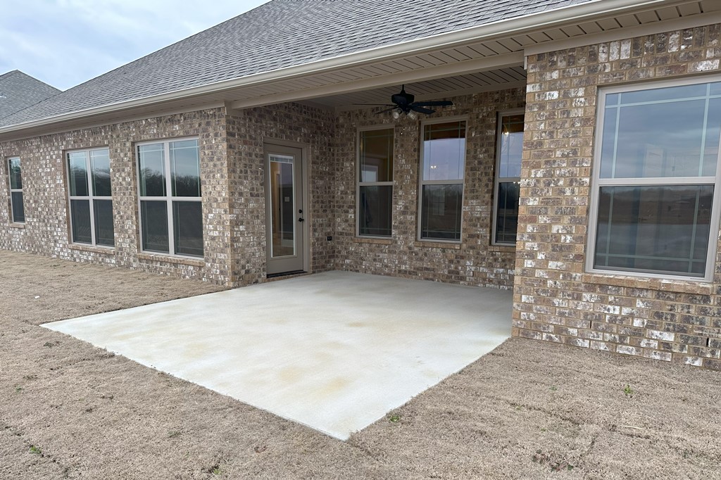 Uncovered Patio And Floodlights On Back Of House
